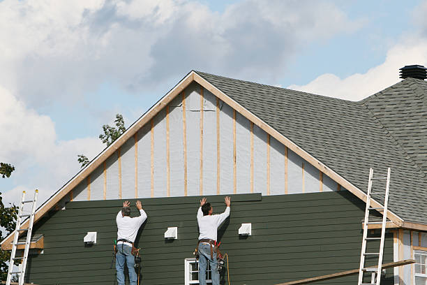 Professional Storm Damage Siding Repair technician working in Freeburg, PA